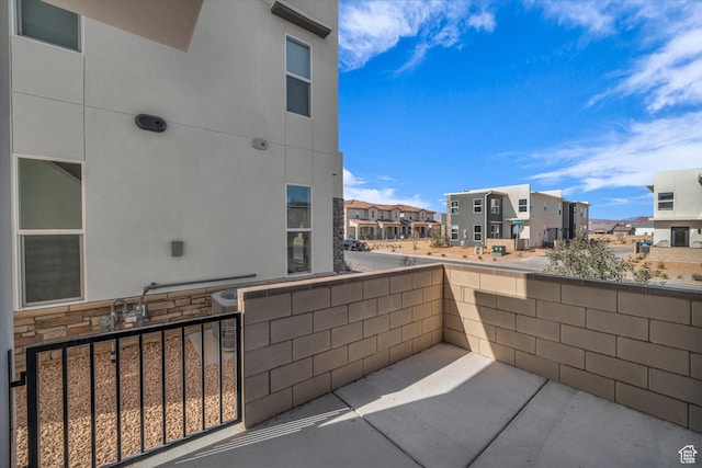 560 W Aqua Cv Unit 506, St George, UT 84790 - view of patio featuring a residential view and a balcony