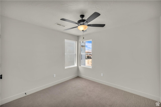560 W Aqua Cv Unit 506, St George, UT 84790 - spare room featuring baseboards, visible vents, a ceiling fan, and light colored carpet