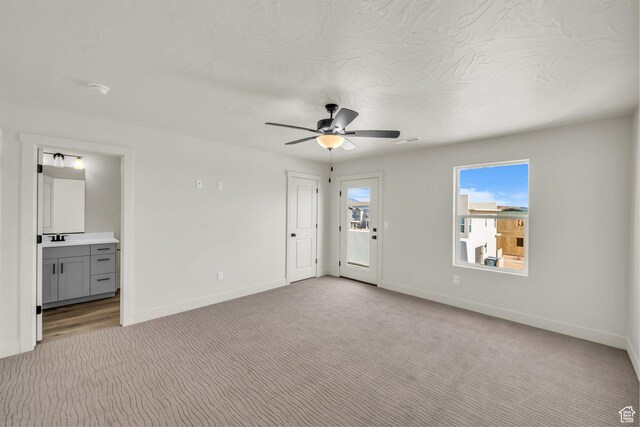560 W Aqua Cv Unit 506, St George, UT 84790 - interior space with baseboards, a ceiling fan, and light colored carpet