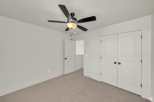 560 W Aqua Cv Unit 506, St George, UT 84790 - unfurnished bedroom featuring light carpet, a ceiling fan, baseboards, and a closet