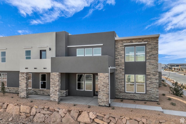 560 W Aqua Cv Unit 506, St George, UT 84790 - view of front of home featuring stone siding and stucco siding