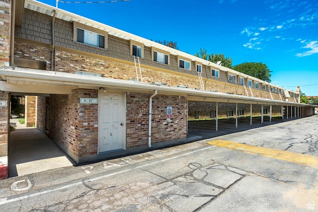 view of property featuring covered parking