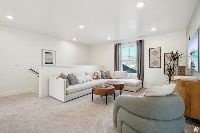 living area with baseboards, recessed lighting, and light colored carpet