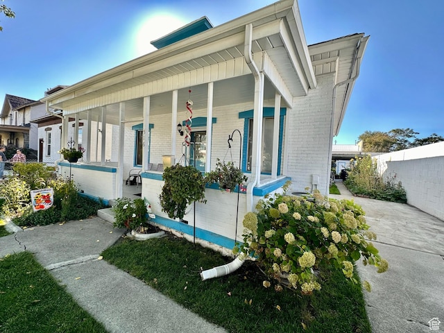 516 S Freedom Blvd, Provo, UT 84601 - exterior space featuring a porch, brick siding, and fence