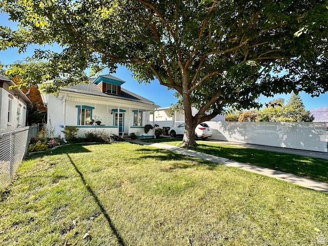 516 S Freedom Blvd, Provo, UT 84601 - exterior space with a porch, a front yard, and fence