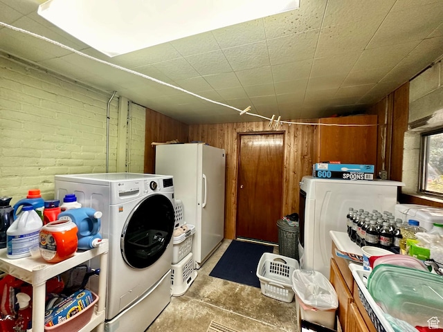 516 S Freedom Blvd, Provo, UT 84601 - laundry room featuring laundry area, brick wall, a sink, and wood walls
