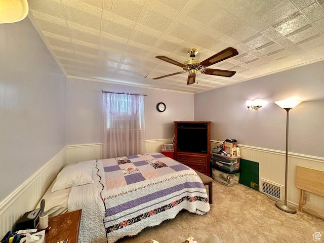 516 S Freedom Blvd, Provo, UT 84601 - carpeted bedroom featuring a wainscoted wall, crown molding, visible vents, and a ceiling fan