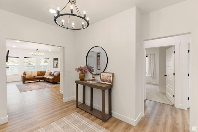 628 S 1080 E, Smithfield, UT 84335 - corridor featuring a chandelier, light wood finished floors, and baseboards