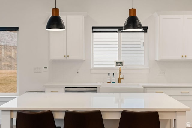 628 S 1080 E, Smithfield, UT 84335 - kitchen with decorative backsplash, a sink, pendant lighting, and white cabinets