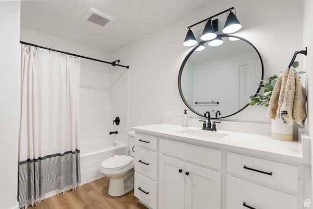 628 S 1080 E, Smithfield, UT 84335 - full bathroom featuring vanity, wood finished floors, toilet, and shower / bath combo with shower curtain