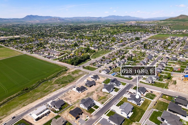 628 S 1080 E, Smithfield, UT 84335 - aerial view of property's location featuring a mountainous background and nearby suburban area
