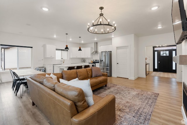 628 S 1080 E, Smithfield, UT 84335 - living area with a chandelier, light wood finished floors, recessed lighting, and baseboards