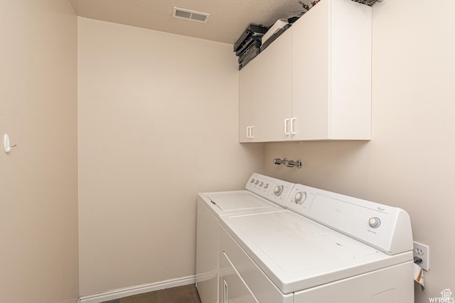 3612 N Huntsman Path Unit 603, Eden, UT 84310 - laundry room featuring washing machine and dryer, cabinet space, visible vents, and baseboards