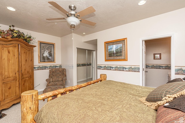 3612 N Huntsman Path Unit 603, Eden, UT 84310 - bedroom with a closet, light carpet, ceiling fan, and a textured ceiling