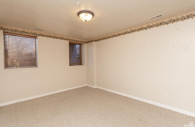 3612 N Huntsman Path Unit 603, Eden, UT 84310 - empty room featuring baseboards, a textured ceiling, visible vents, and carpet flooring
