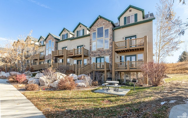 3612 N Huntsman Path Unit 603, Eden, UT 84310 - exterior space featuring stone siding, a patio, and french doors