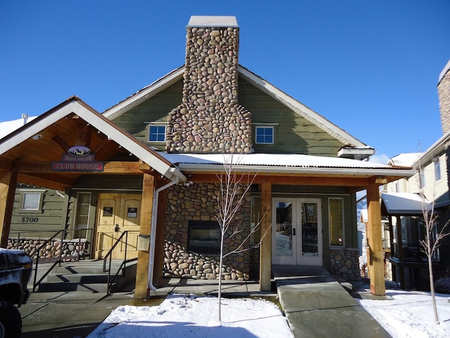 3612 N Huntsman Path Unit 603, Eden, UT 84310 - view of front of house featuring stone siding, french doors, and a chimney