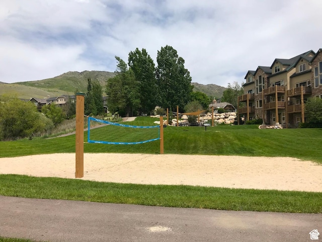 3612 N Huntsman Path Unit 603, Eden, UT 84310 - view of property's community with a mountain view, a lawn, and volleyball court