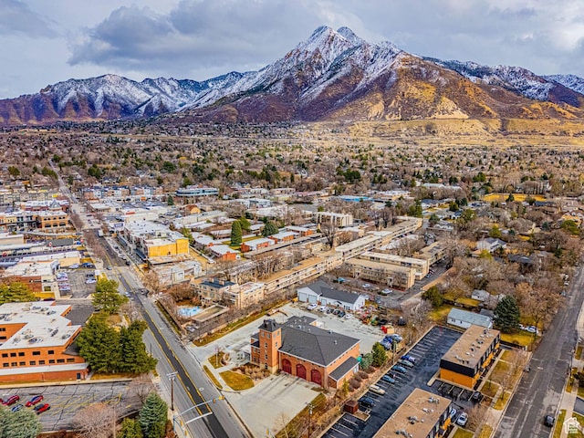 birds eye view of property featuring a mountain view