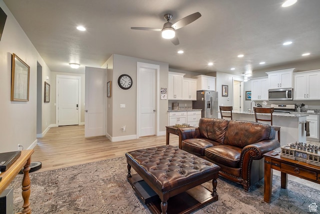 24 S 900 E, Hyde Park, UT 84318 - living area featuring baseboards, light wood finished floors, and recessed lighting