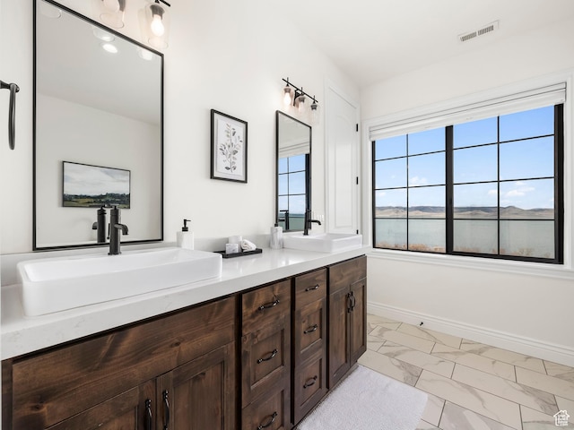 5351 S Lincoln Beach Rd, Spanish Fork, UT 84660 - bathroom with marble finish floor, baseboards, visible vents, and a sink