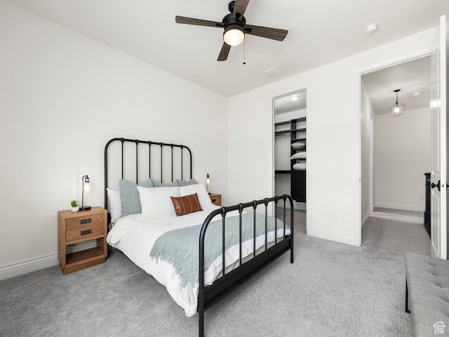 5351 S Lincoln Beach Rd, Spanish Fork, UT 84660 - carpeted bedroom with a walk in closet, a closet, ceiling fan, and baseboards