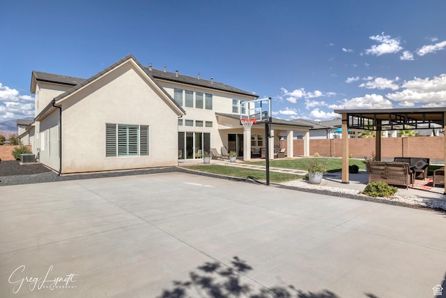 219 W Elinor Ln, Washington, UT 84780 - rear view of property with a patio, fence, and stucco siding