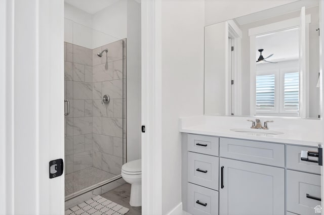219 W Elinor Ln, Washington, UT 84780 - bathroom with toilet, a stall shower, ceiling fan, vanity, and wood finished floors