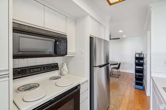 777 E S Temple S Unit 4A, Salt Lake City, UT 84102 - kitchen featuring freestanding refrigerator, white electric range, black microwave, tasteful backsplash, and ornamental molding