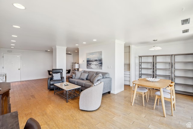 777 E S Temple S Unit 4A, Salt Lake City, UT 84102 - living room with light wood finished floors, recessed lighting, crown molding, and decorative columns