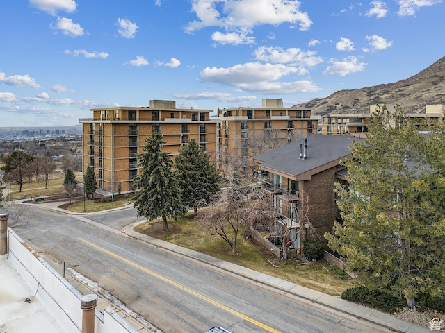 view of building exterior featuring a mountain view