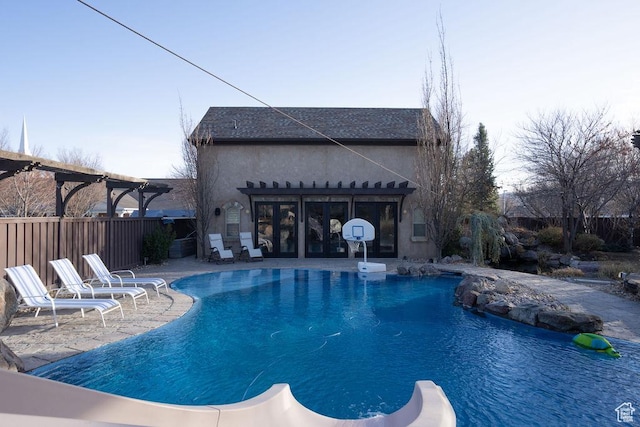 view of swimming pool with a patio area, fence, a fenced in pool, and a pergola