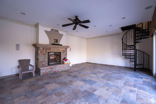 unfurnished living room featuring ceiling fan, a fireplace, baseboards, stairs, and ornamental molding