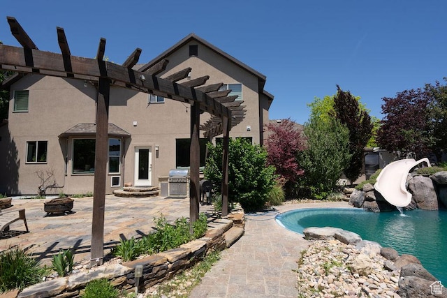 3643 W 12125 S, Riverton, UT 84065 - swimming pool with an outdoor fire pit, a water slide, a patio, and a pergola
