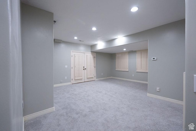 below grade area with baseboards, carpet flooring, and recessed lighting