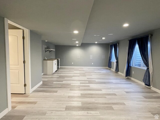 8416 N Sun Crest Dr, Eagle Mountain, UT 84005 - below grade area featuring light wood finished floors, recessed lighting, and baseboards