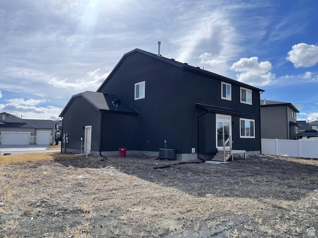 8416 N Sun Crest Dr, Eagle Mountain, UT 84005 - back of property with entry steps, central AC unit, and fence