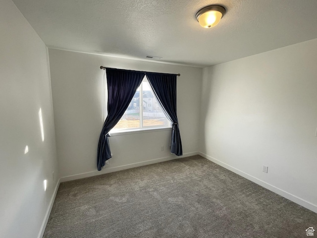 8416 N Sun Crest Dr, Eagle Mountain, UT 84005 - carpeted empty room featuring visible vents, baseboards, and a textured ceiling