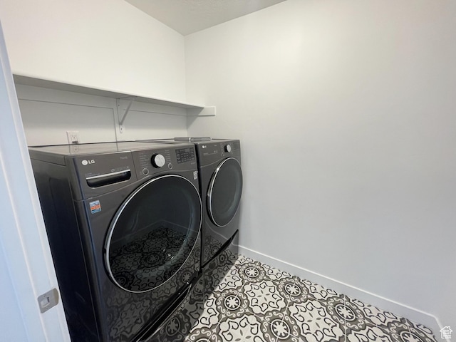 8416 N Sun Crest Dr, Eagle Mountain, UT 84005 - laundry area with laundry area, washing machine and dryer, baseboards, and tile patterned flooring