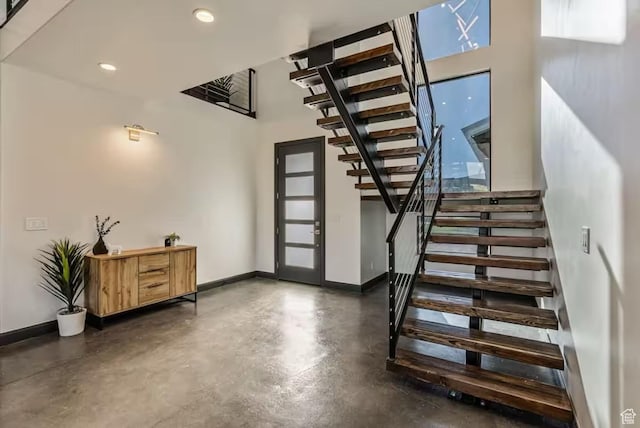 840 W Hilltop Ct, Francis, UT 84036 - entrance foyer featuring baseboards, stairway, a high ceiling, concrete floors, and recessed lighting
