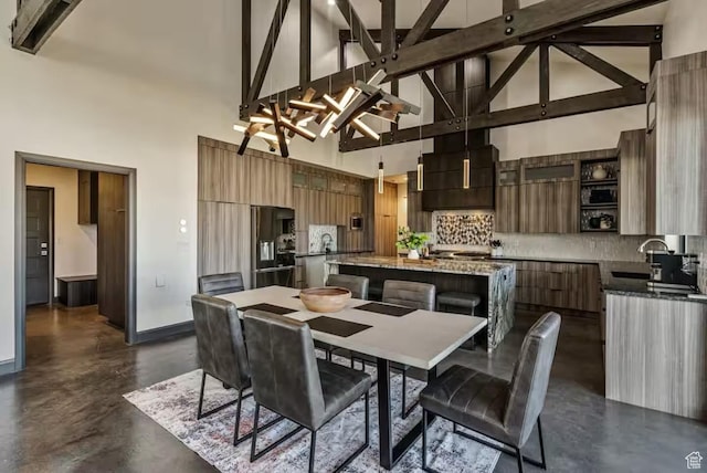 840 W Hilltop Ct, Francis, UT 84036 - kitchen with a kitchen island, modern cabinets, a sink, and decorative backsplash