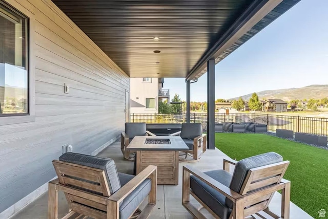 840 W Hilltop Ct, Francis, UT 84036 - view of patio / terrace with fence, a mountain view, and an outdoor living space with a fire pit