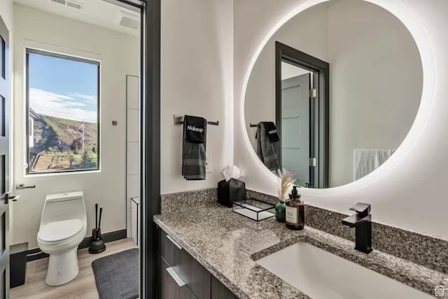 840 W Hilltop Ct, Francis, UT 84036 - bathroom featuring visible vents, vanity, toilet, and wood finished floors
