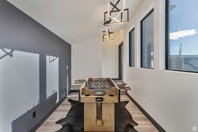 840 W Hilltop Ct, Francis, UT 84036 - playroom featuring lofted ceiling, baseboards, and wood finished floors