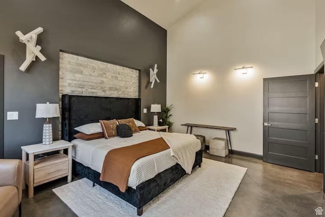 840 W Hilltop Ct, Francis, UT 84036 - bedroom with finished concrete flooring, high vaulted ceiling, and baseboards