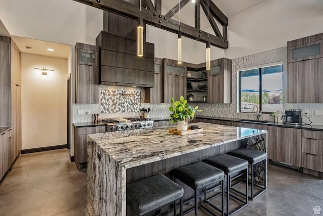 840 W Hilltop Ct, Francis, UT 84036 - kitchen with open shelves, dark stone countertops, modern cabinets, concrete flooring, and a kitchen breakfast bar