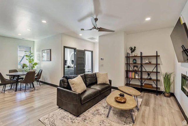 840 W Hilltop Ct, Francis, UT 84036 - living area featuring light wood finished floors, recessed lighting, visible vents, a glass covered fireplace, and baseboards