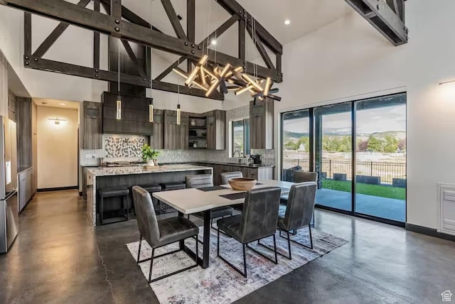 840 W Hilltop Ct, Francis, UT 84036 - dining area with high vaulted ceiling, finished concrete floors, and baseboards