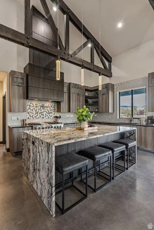 kitchen with modern cabinets and high vaulted ceiling
