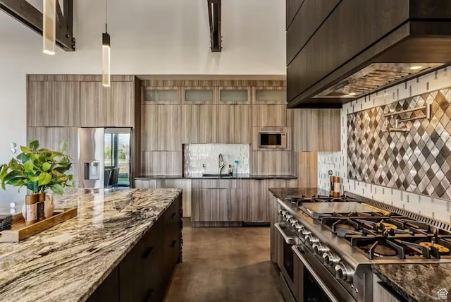 840 W Hilltop Ct, Francis, UT 84036 - kitchen featuring backsplash, appliances with stainless steel finishes, a sink, modern cabinets, and wall chimney exhaust hood